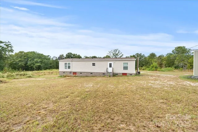 a view of a large garden with large trees