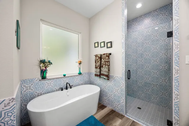 a white bath tub sitting next to a white sink