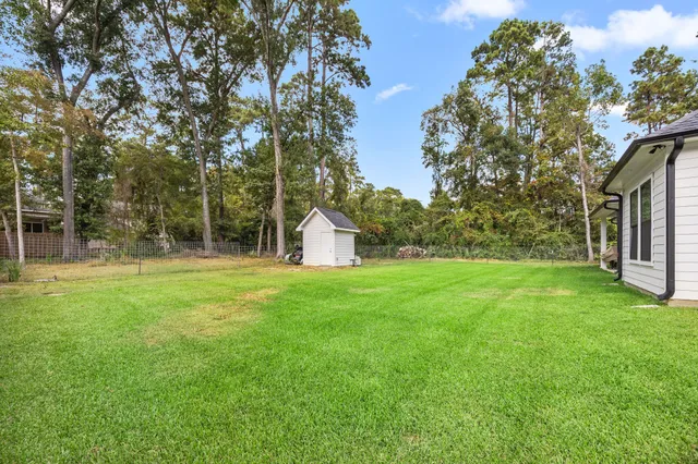 a house view with a backyard space