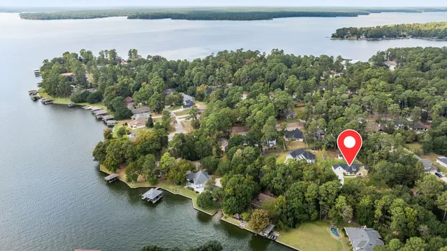an aerial view of a residential houses with outdoor space and swimming pool