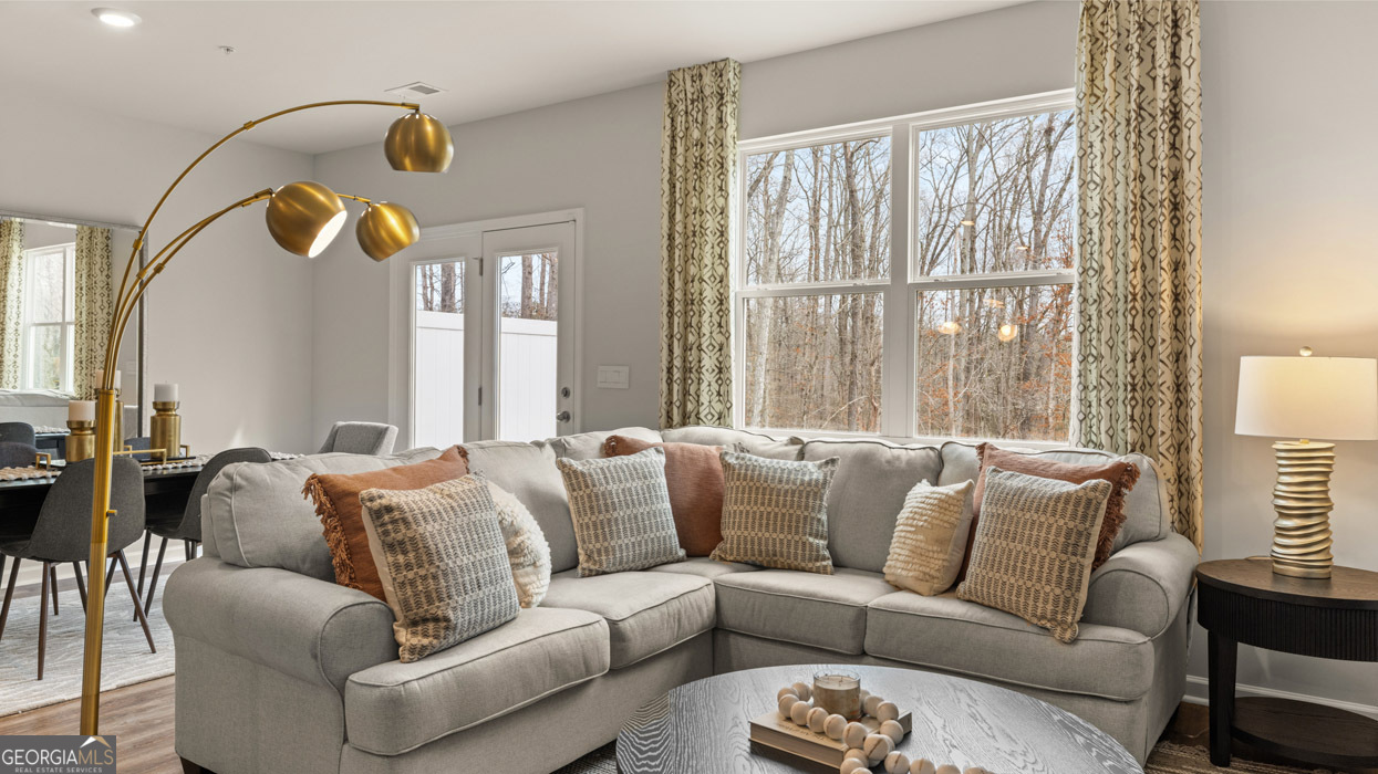 241 Sound Circle Stockbridge, GA 30281 - Photo 31 of 64 a living room with furniture and outdoor windows