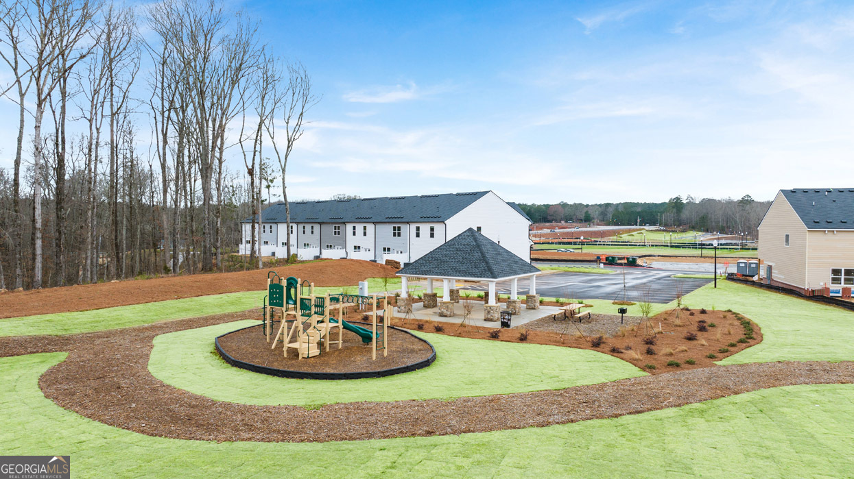 241 Sound Circle Stockbridge, GA 30281 - Photo 8 of 64 a view of a swimming pool with a yard