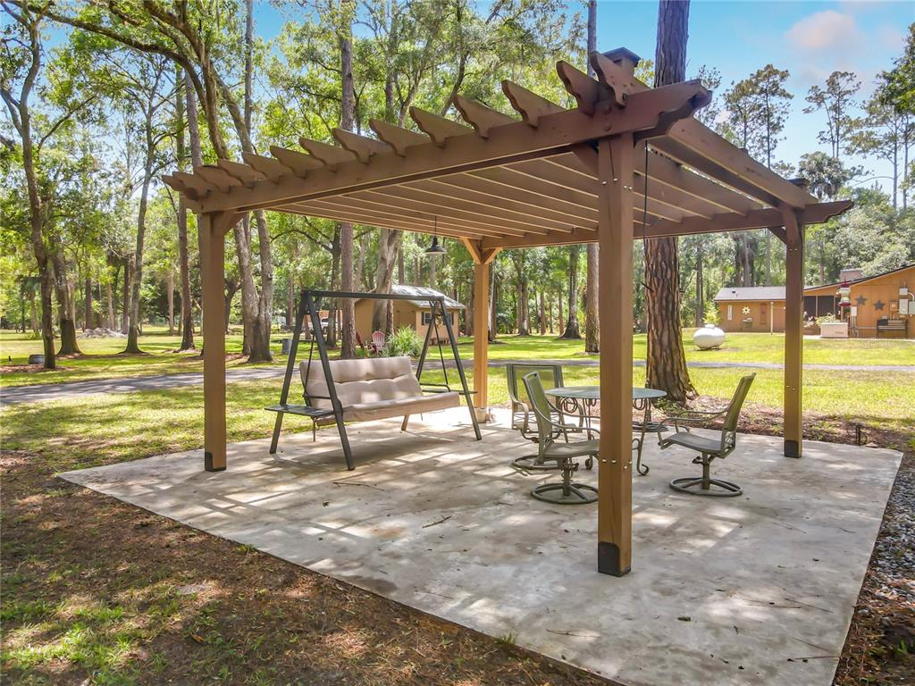 1395 Maytown Road Osteen, FL 32764 - Photo 49 of 65 a view of a swimming pool with a patio