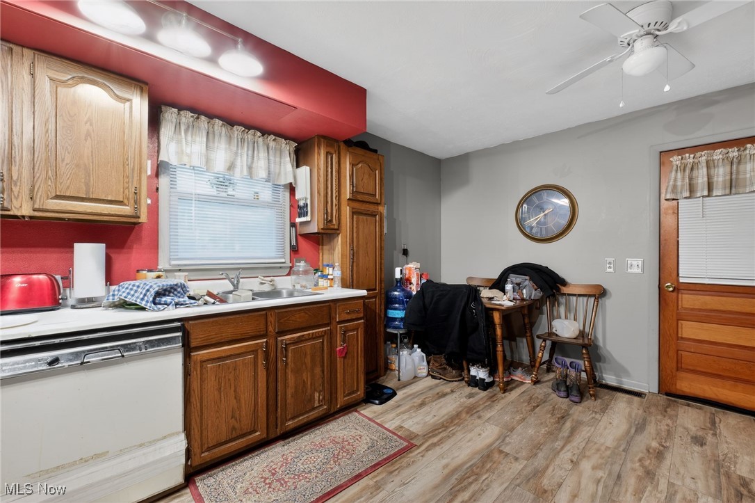 72631 Broadhead Road Kimbolton, OH 43749 - Photo 13 of 21 Kitchen featuring white dishwasher, light countertops, light wood finished floors, and a ceiling fan