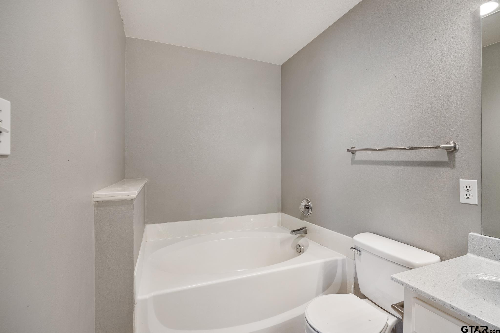 7000 Ranch Hill Drive Flint, TX 75762 - Photo 15 of 25 a white toilet sitting next to a white tub