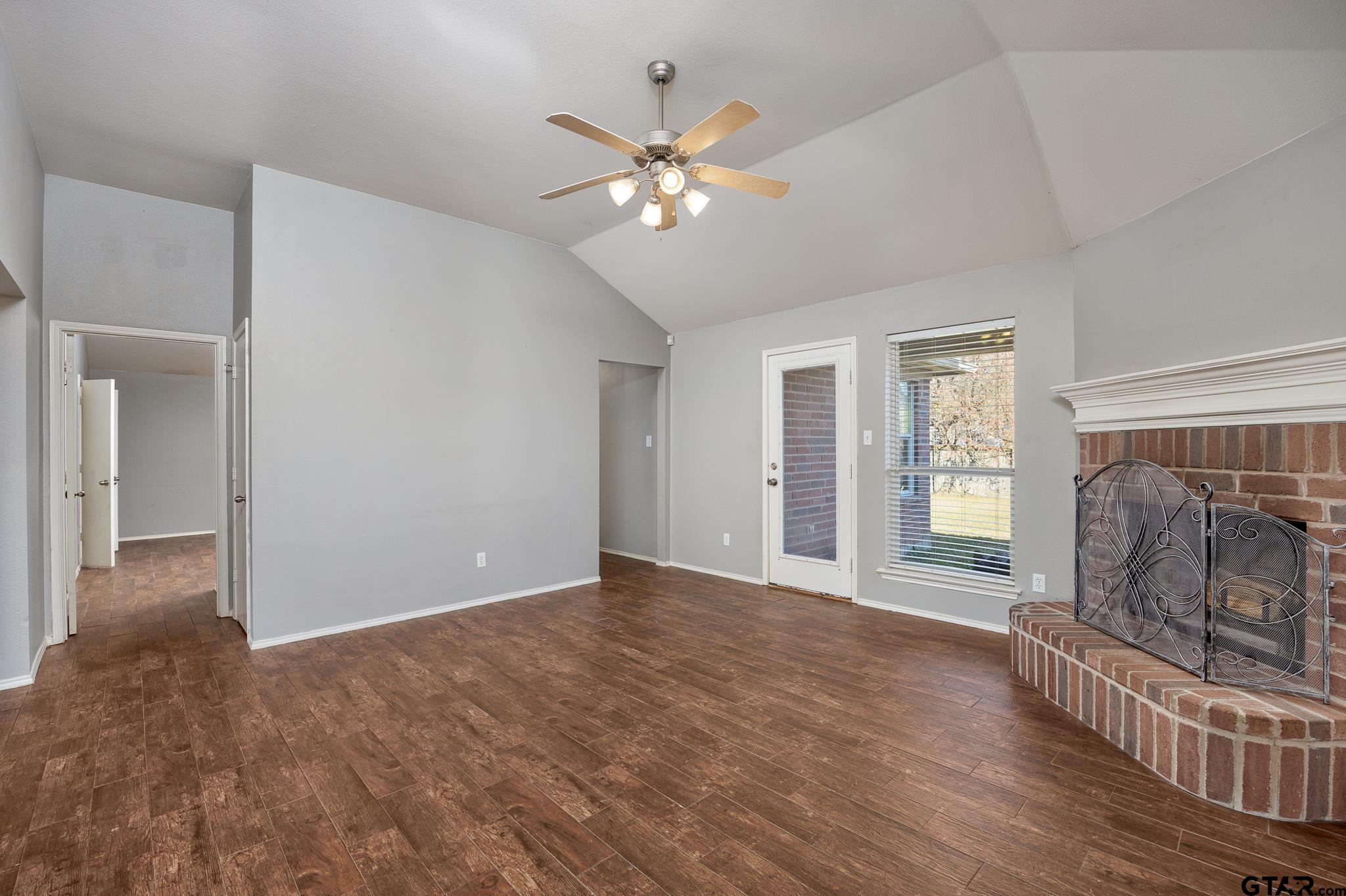 7000 Ranch Hill Drive Flint, TX 75762 - Photo 8 of 25 a view of livingroom with window ceiling fan and hardwood floor