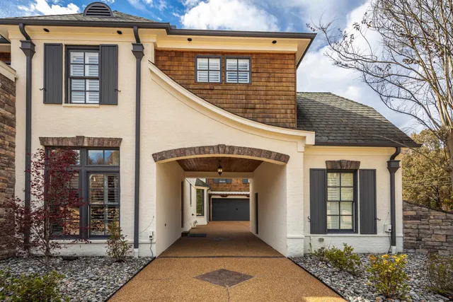 a view of kitchen with kitchen island a refrigerator and a sink