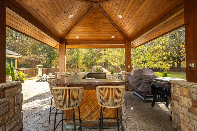 a view of swimming pool with outdoor seating