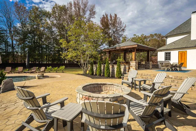 a view of a patio with swimming pool