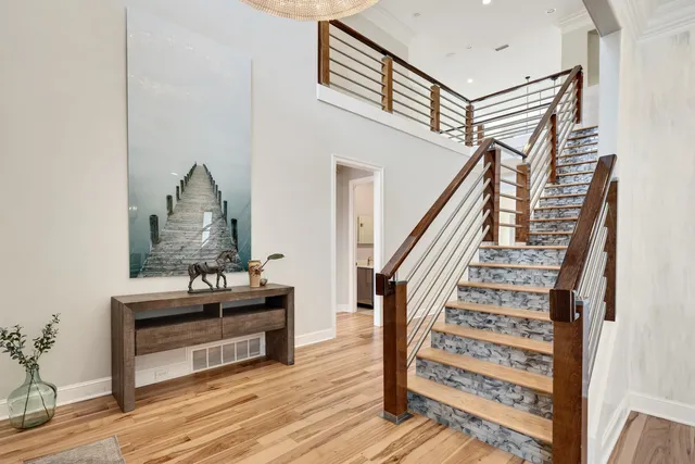 a view of entryway wooden floor and staircase