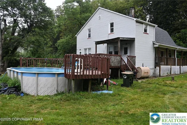 a view of backyard with deck