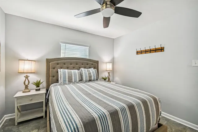 a bedroom with a bed and a lamp