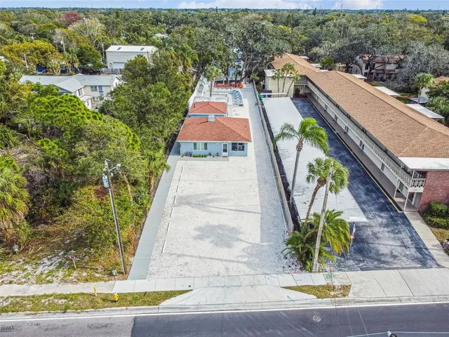 a aerial view of a house with a yard