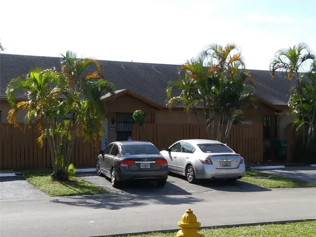 a view of a car parked in front of a house
