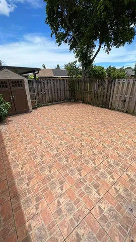 an aerial view of a house with a swimming pool