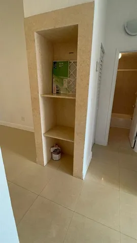 a view of an empty room with a bathroom