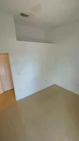 a view of a refrigerator in a room