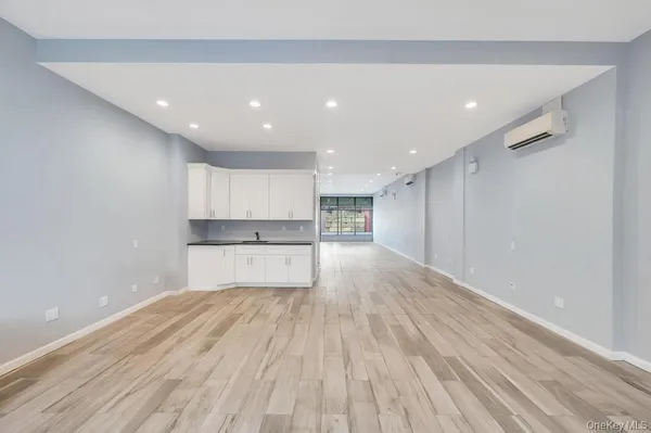 a view of kitchen with wooden floor
