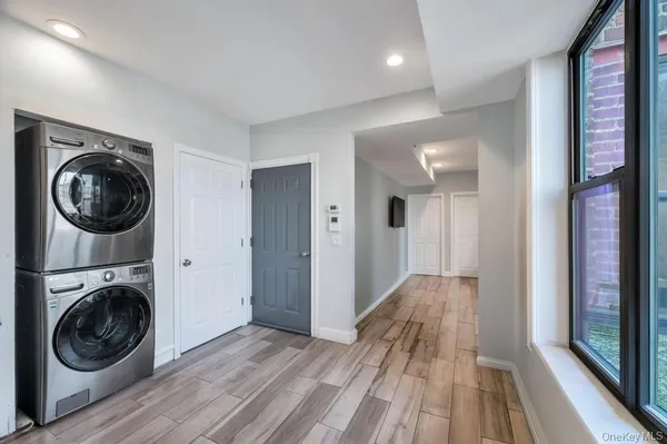a view of a hallway with washer and dryer