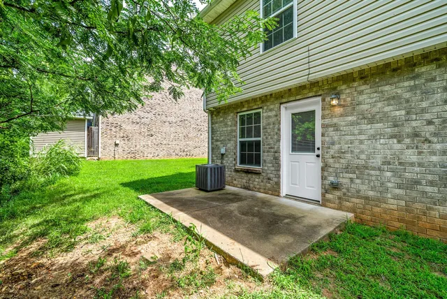 a view of a house with a yard and plants