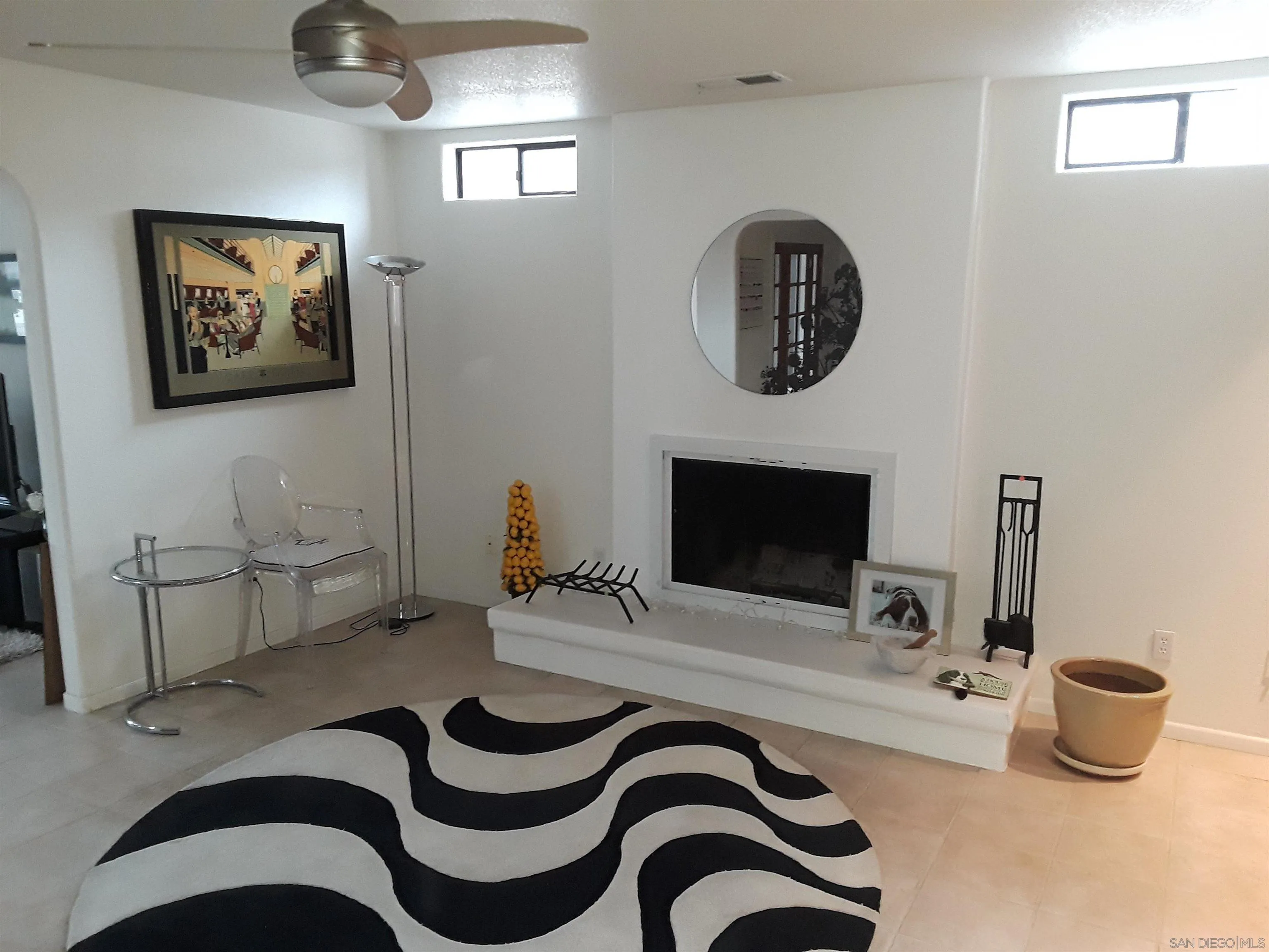 5142 Providence Road San Diego, CA 92117 - Photo 3 of 18 a bedroom with a bed and a chair