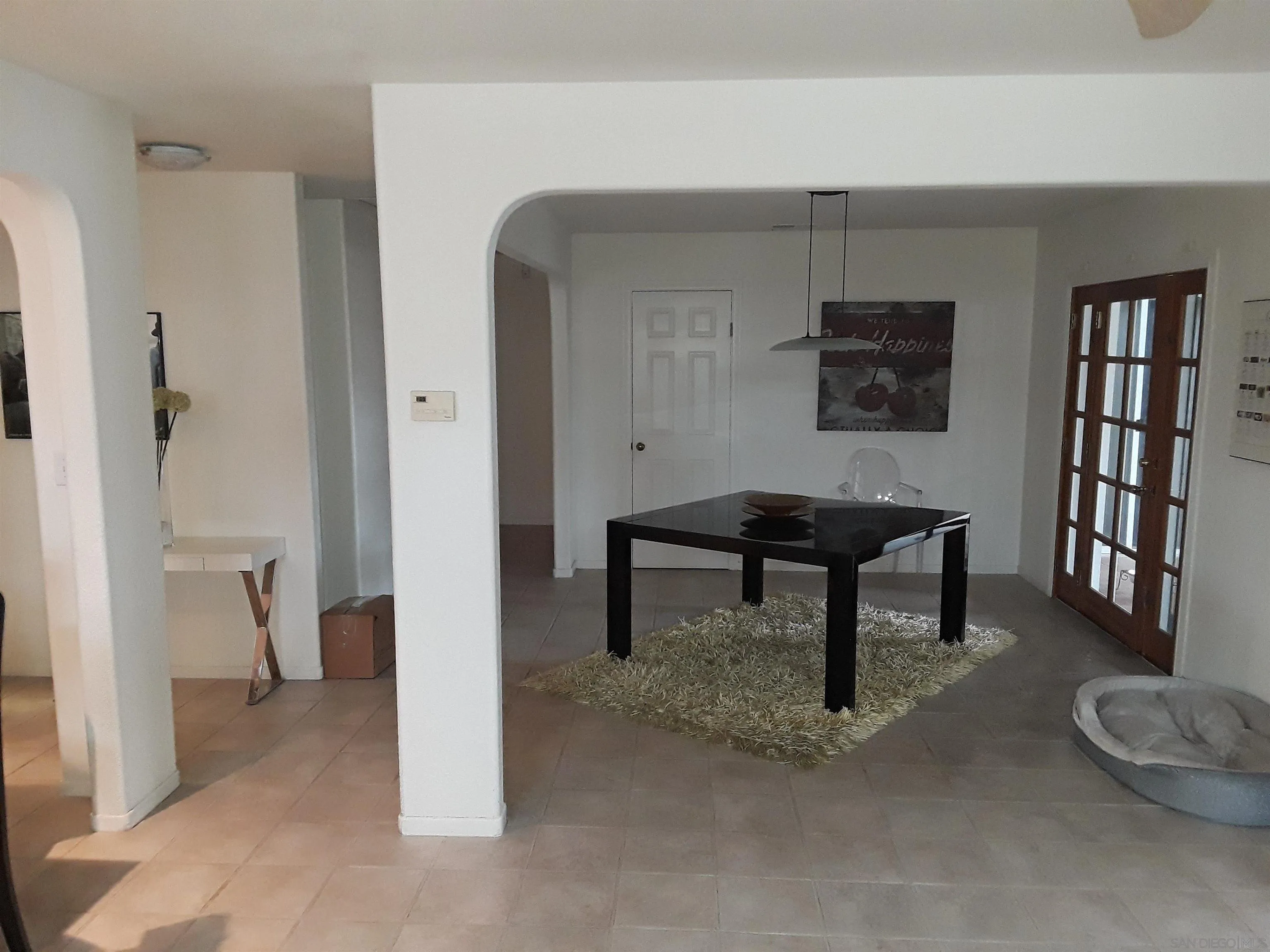 5142 Providence Road San Diego, CA 92117 - Photo 5 of 18 a living room with furniture and a painting on the wall