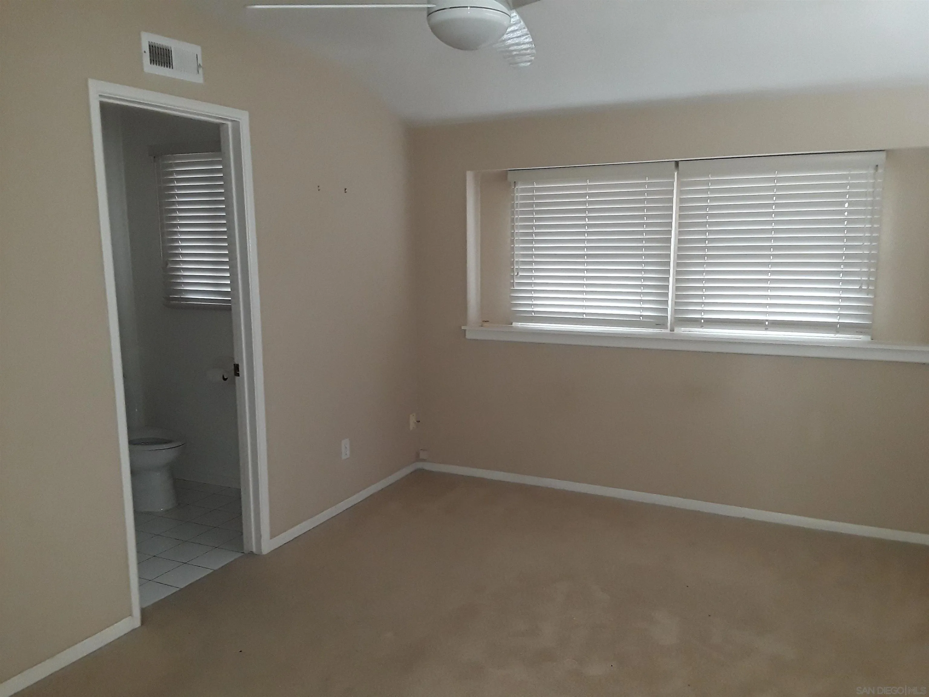 5142 Providence Road San Diego, CA 92117 - Photo 10 of 18 an empty room with a window