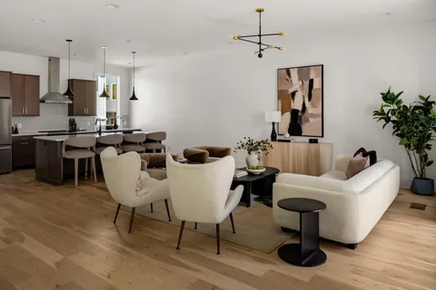 a kitchen with a table and chairs in it