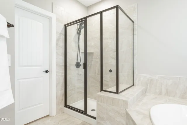 a bathroom with a shower and a sink
