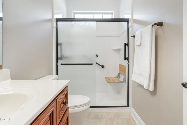 a bathroom with a shower and a toilet