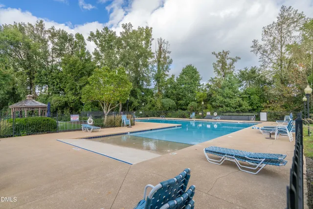 a view of a swimming pool with lounge chair