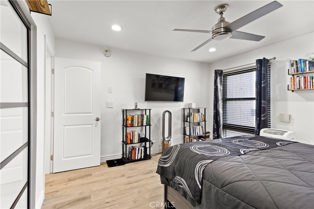 7740 Redlands Street Playa del Rey, CA 90293 - Photo 13 of 14 a bedroom with a bed window and a flat screen tv