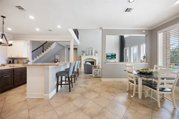 a living room with furniture a table and chairs