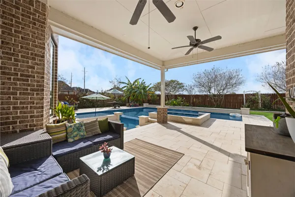 a outdoor space with patio couch and a potted plant