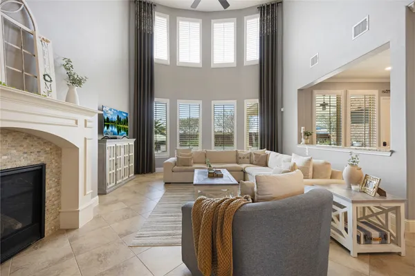 a living room with furniture and a fireplace