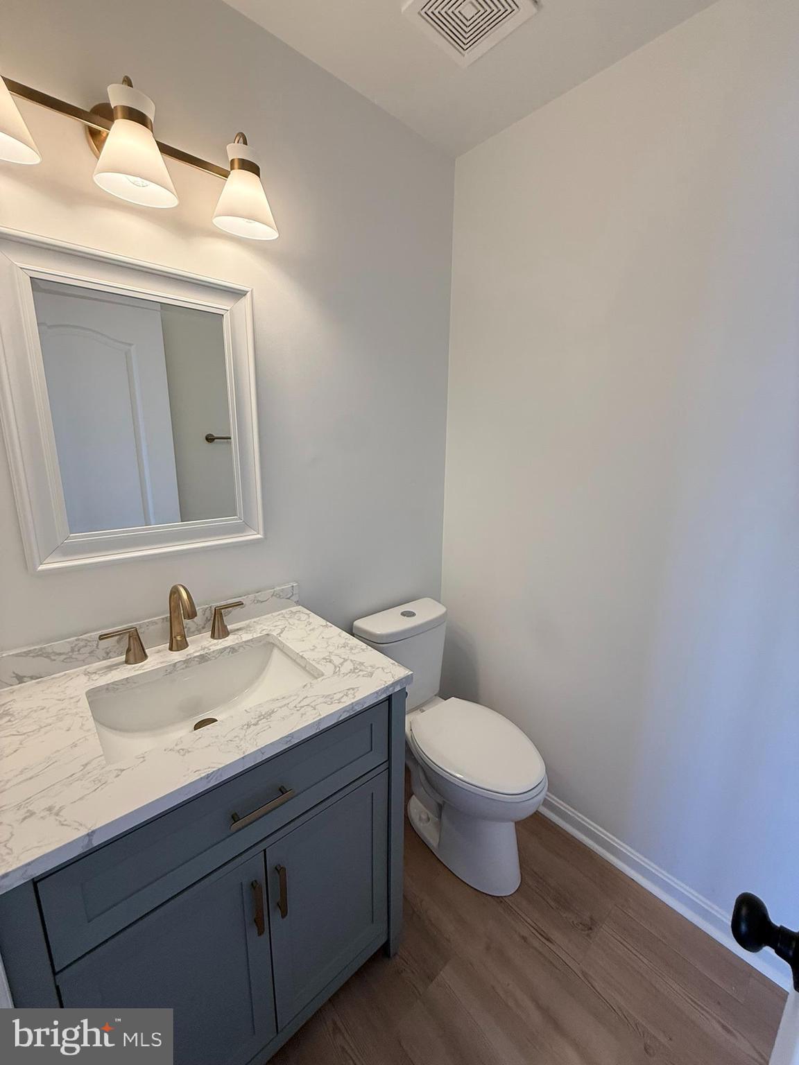29679 Janets Way Easton, MD 21601 - Photo 12 of 23 a bathroom with a toilet sink and mirror