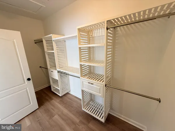 a bathroom with a window and a shower