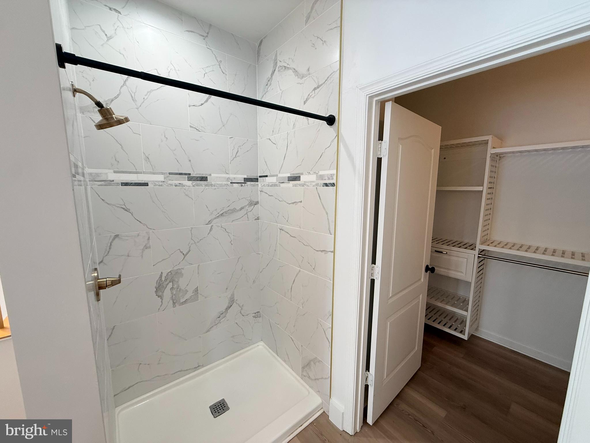 29679 Janets Way Easton, MD 21601 - Photo 16 of 23 a bathroom with a tub and shower
