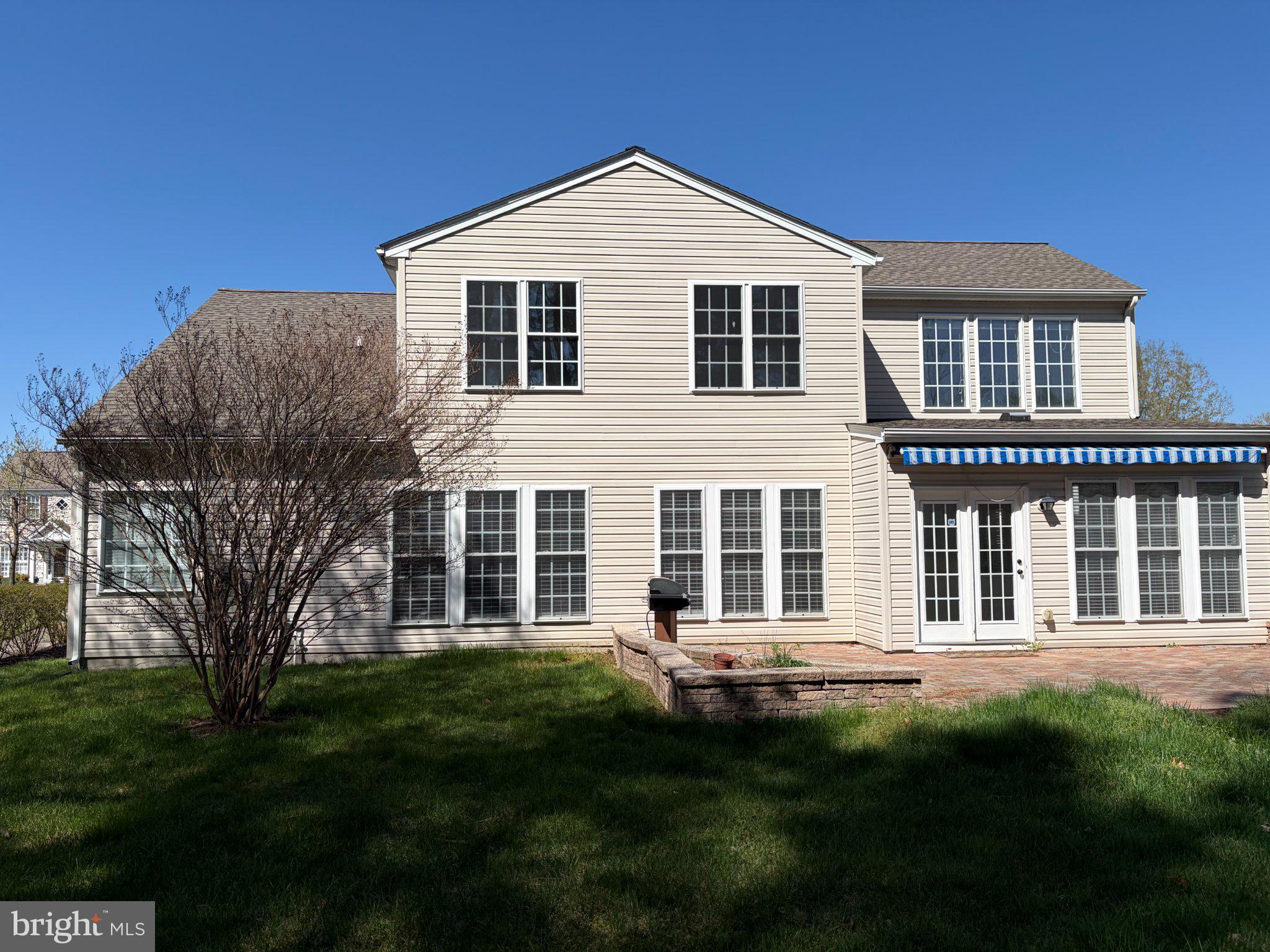 29679 Janets Way Easton, MD 21601 - Photo 2 of 23 a front view of a house with a garden