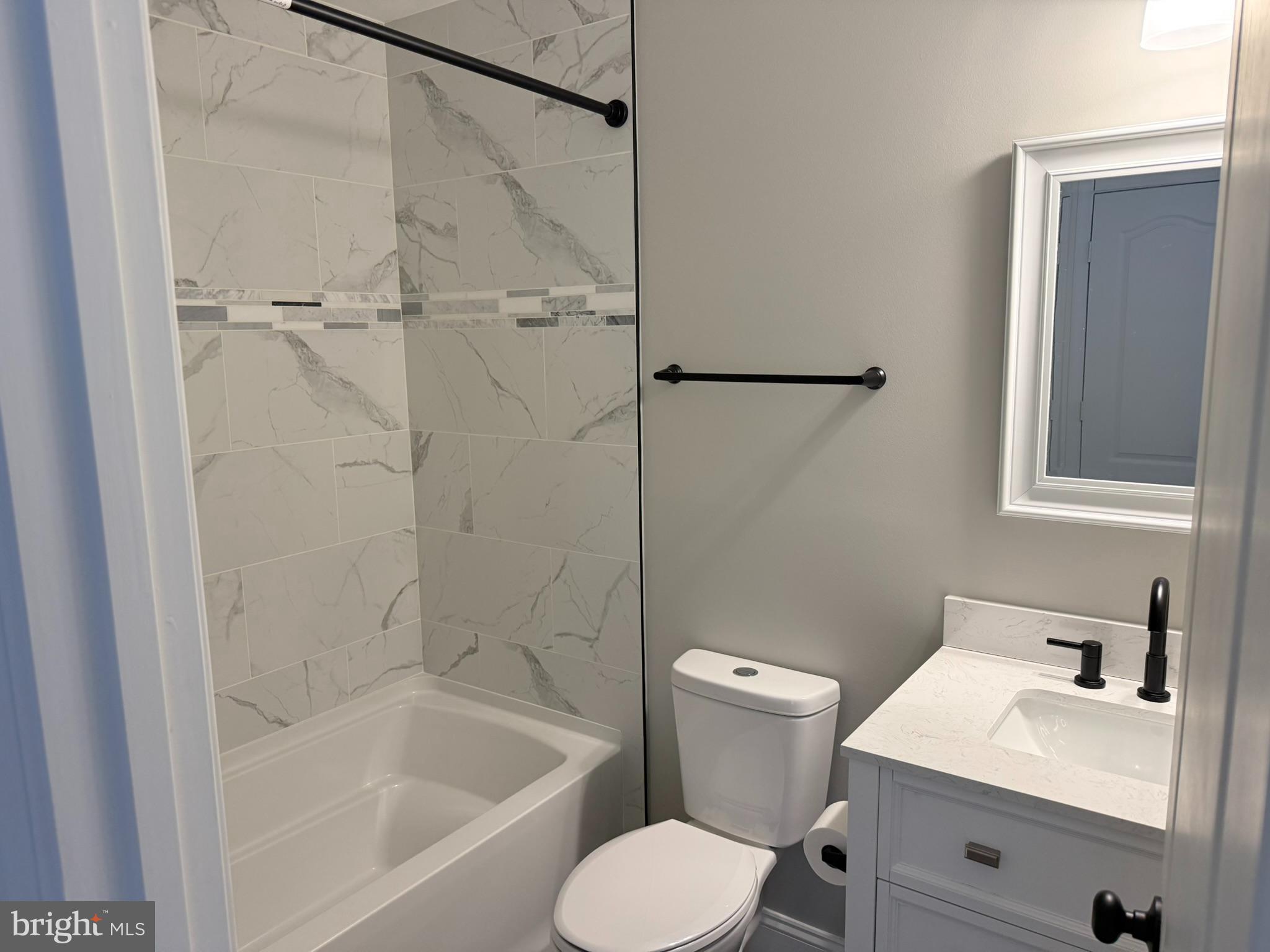 29679 Janets Way Easton, MD 21601 - Photo 23 of 23 a bathroom with a sink toilet and shower