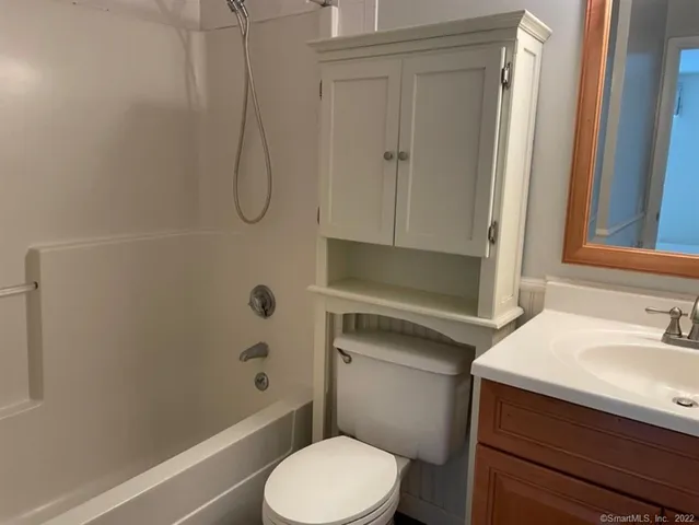 an empty room with a empty space and windows