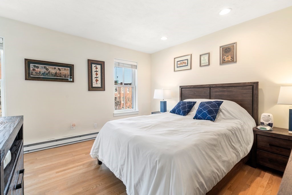 231 West Canton Street, Unit 4 Boston, MA 02116 - Photo 13 of 17 a bedroom with a large bed and a window