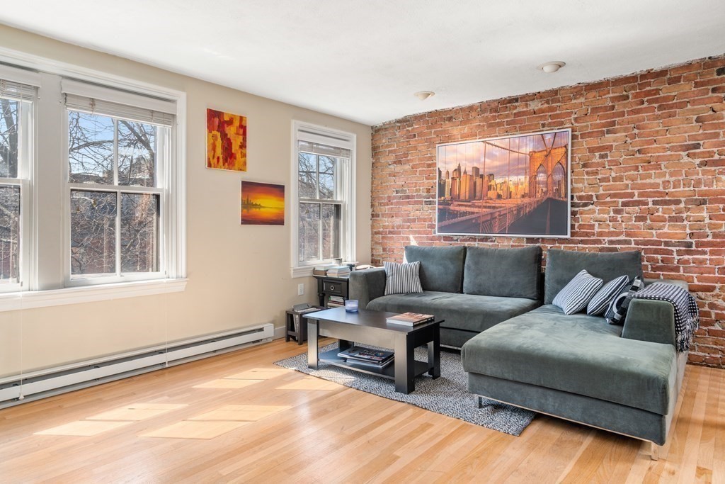 231 West Canton Street, Unit 4 Boston, MA 02116 - Photo 4 of 17 a living room with furniture and a large window