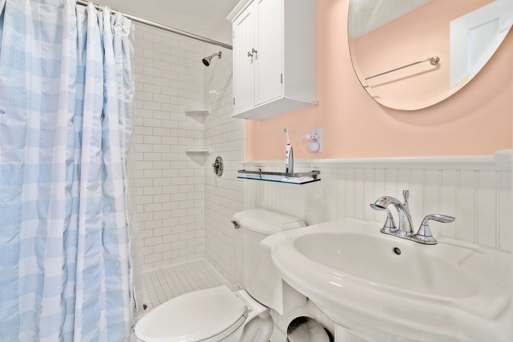 231 West Canton Street, Unit 4 Boston, MA 02116 - Photo 10 of 17 a bathroom with a sink a toilet and shower