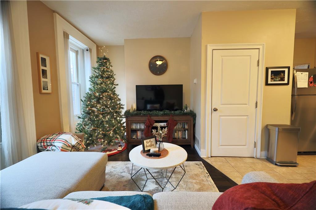 515 Lockhart Street, Unit 3 Pittsburgh, PA 15212 - Photo 8 of 27 a living room with furniture and a flat screen tv