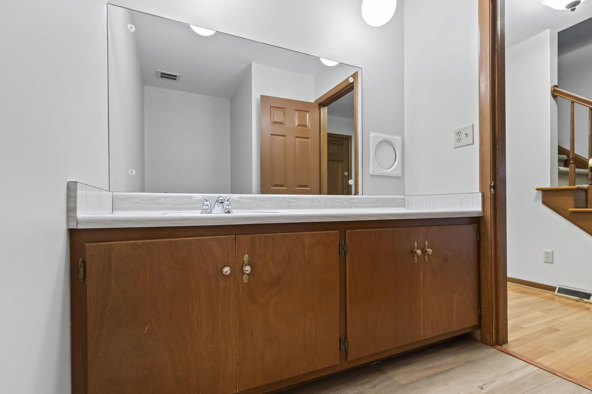 999 Birchmont Road Columbus, OH 43220 - Photo 23 of 53 Large vanity in the first floor half bath. This room has new flooring and toilet.
