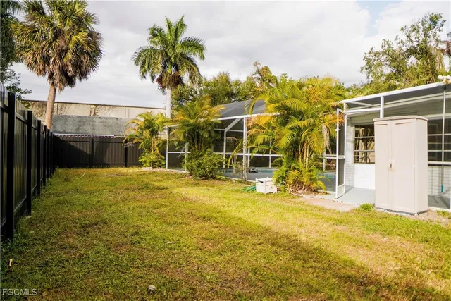 a view of a backyard with sitting area
