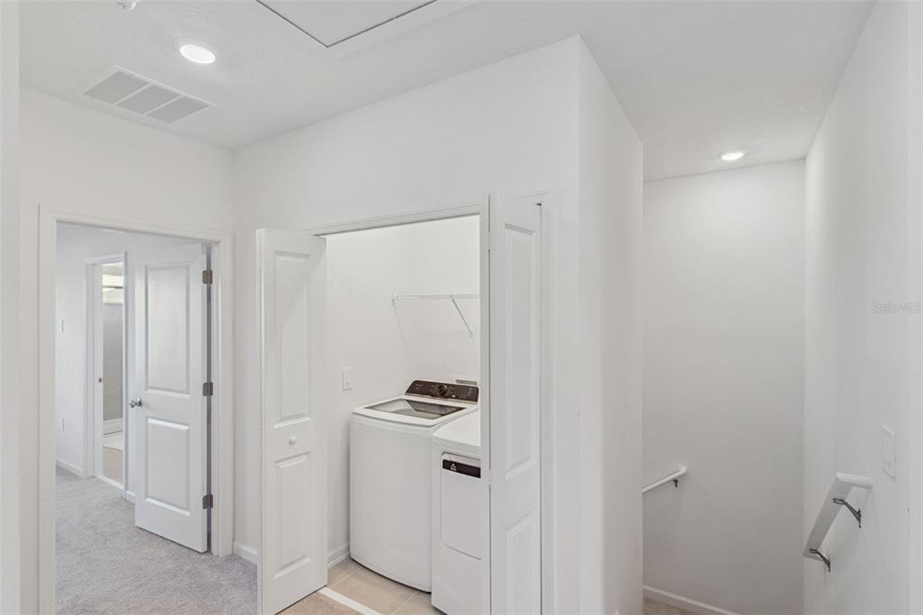 2653 Skyline Loop Kissimmee, FL 34758 - Photo 16 of 42 a walk in closet with white cabinets