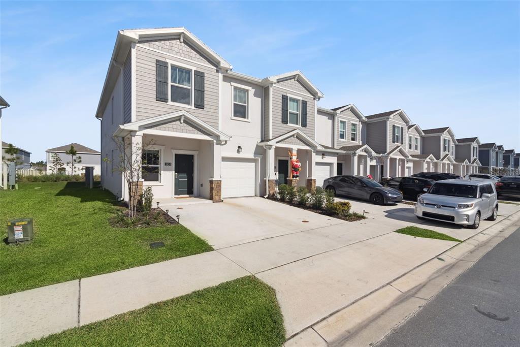 2653 Skyline Loop Kissimmee, FL 34758 - Photo 2 of 42 a front view of a house with a yard