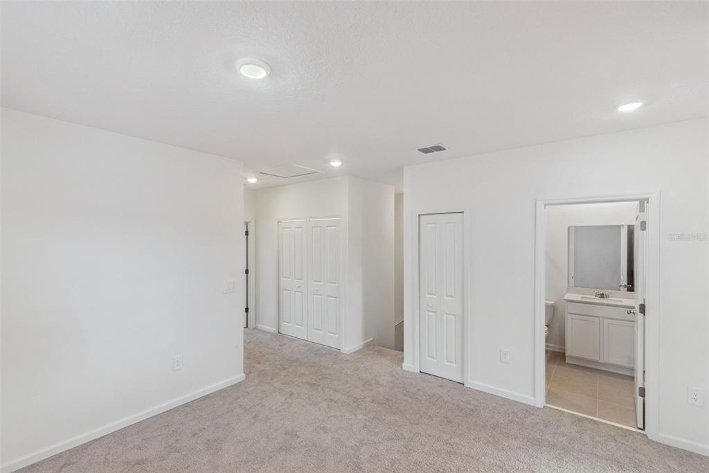 2653 Skyline Loop Kissimmee, FL 34758 - Photo 23 of 42 an empty room with a bathroom and mirror